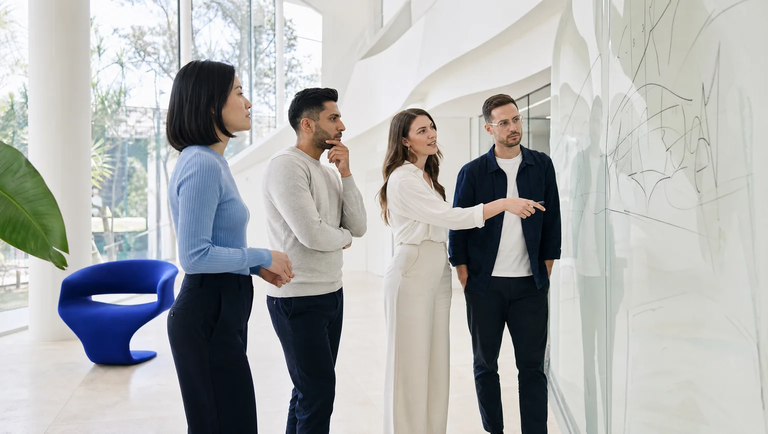 team planning at a glass strategy wall
